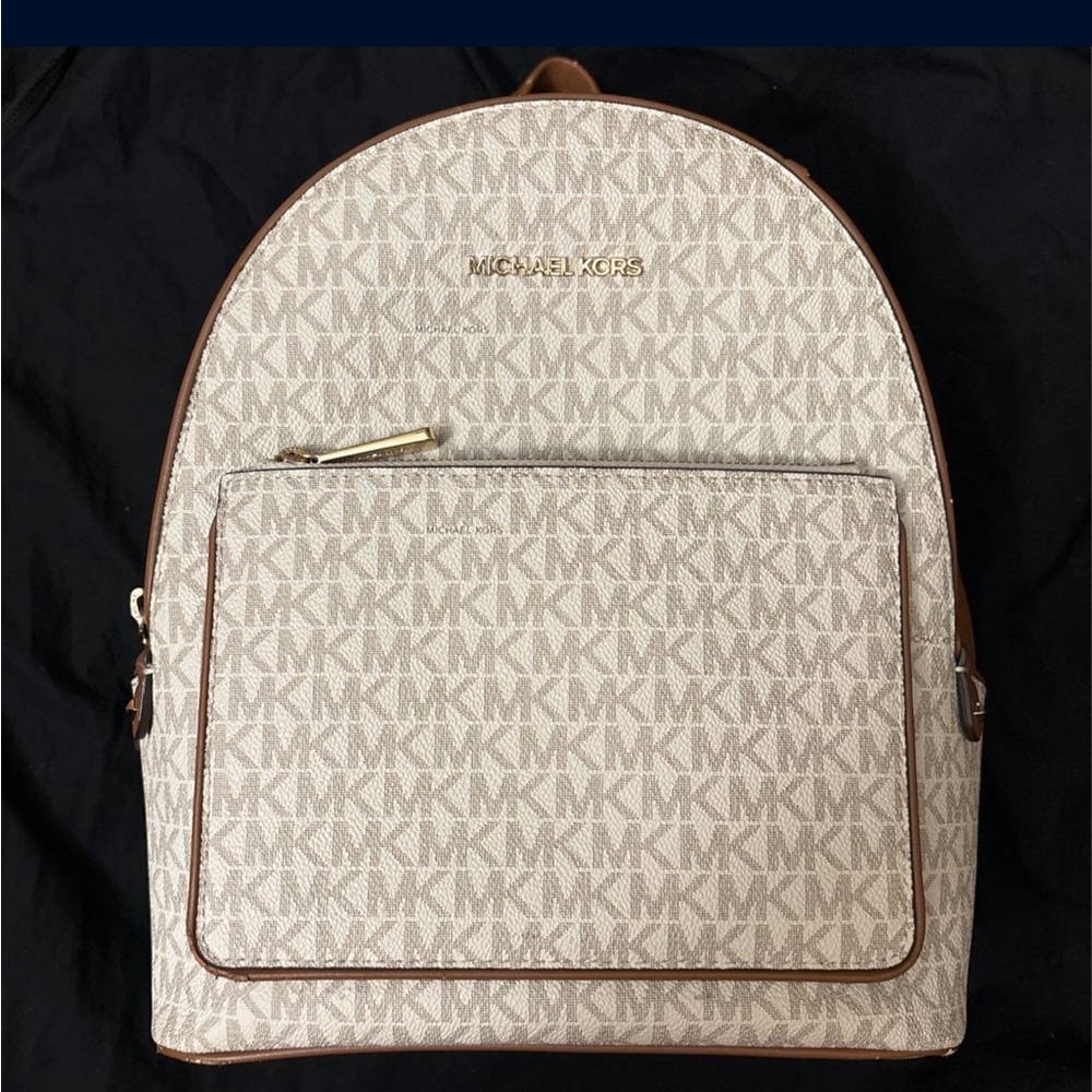 Women’s Michael kors white and brown back pack used normal wear